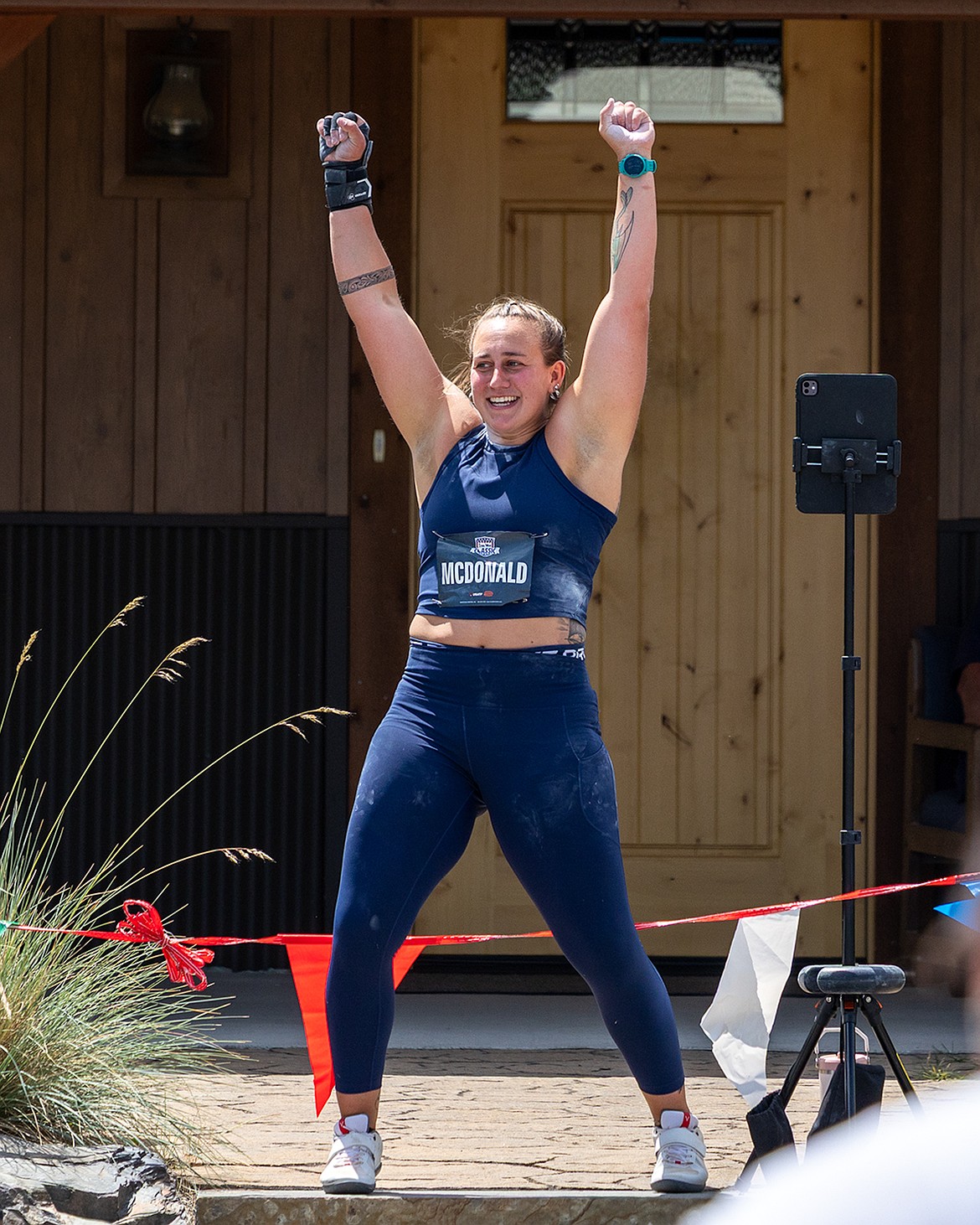 Photo by JERRY VICK
Gabriella McDonald celebrates her winning throw of 56 feet, 2 inches in the women's shot put on the first day of the Iron Wood Throws Classic on Thursday in Rathdrum.
