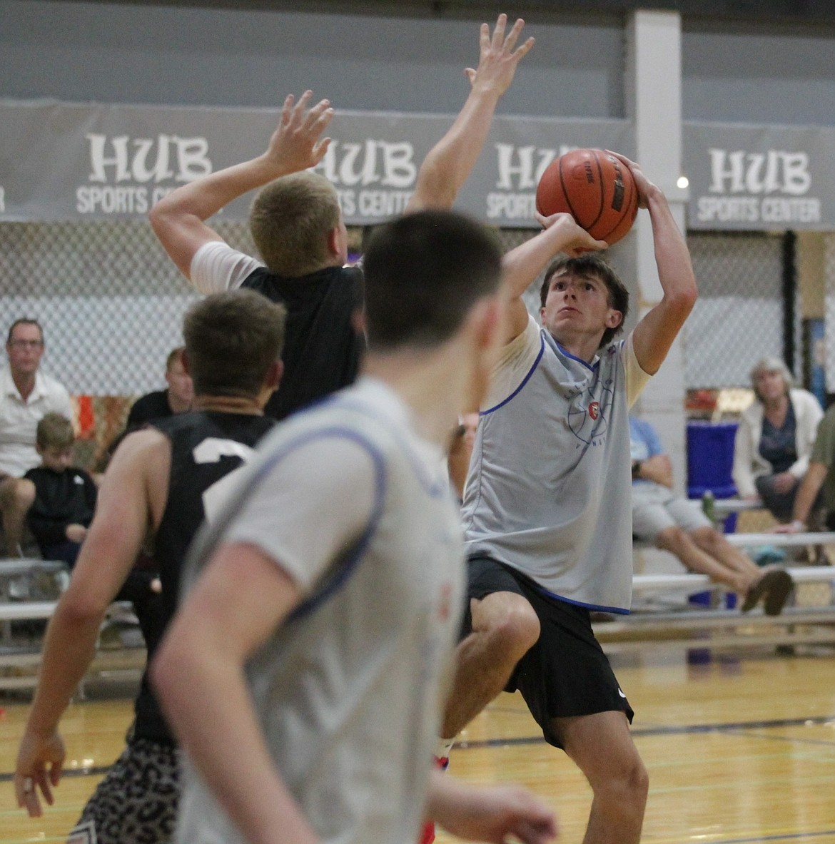 MARK NELKE/Press
Coeur d'Alene High rising senior Davis Whittaker hits the winning basket in overtime as the Vikings defeated Liberty of Spangle, Wash., in their first game at the CDA Summer Shootout at the HUB Sports Center in Liberty Lake.