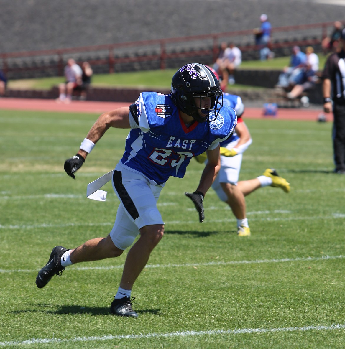 The Knights’ Shea Stevenson (23) sprints downfield after the ball was snapped during the Earl Barden Classic. Stevenson was a two-way player for the Knights, playing receiver and defensive back for Royal High School.