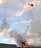 Garred Road Fire continues to expand, threatening structures and infrastructure