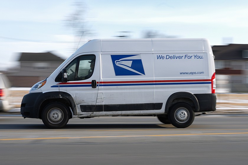 FILE - A United States Postal Service truck on its route. (AP Photo/Paul Sancya, File)