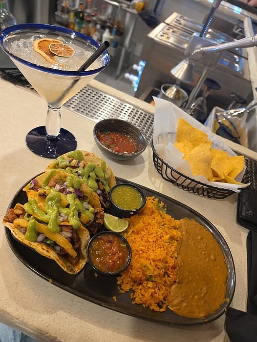 Tacos Al Pastor with beans and rice.
