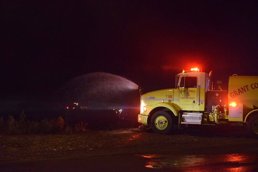 Grant County Fire District 5 crews fight a fire caused by fireworks in July 2025. People are advised to know the regulations in their area before setting off any fireworks.