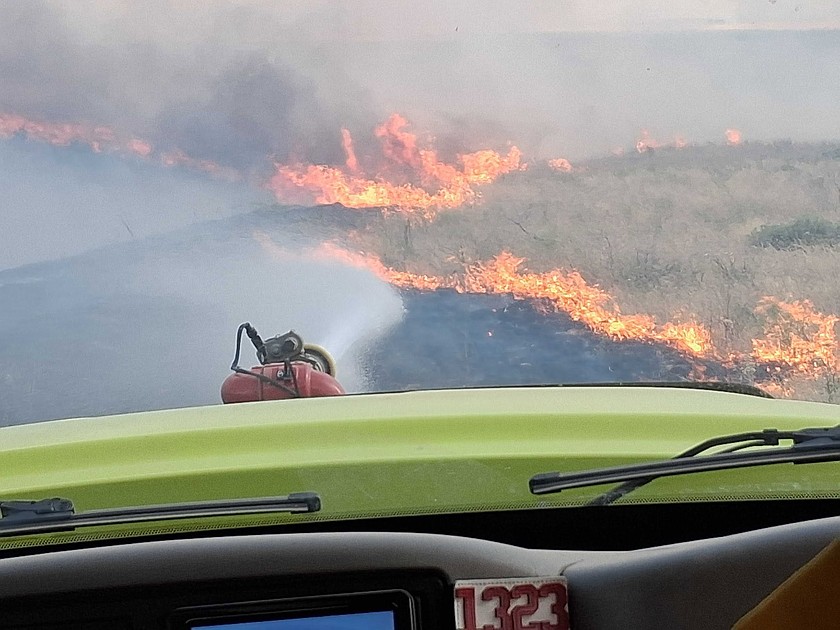 Grant County Fire District 13 crews work the fire line last week. Fire District 13 Chief Jim Stucky said people should think carefully about setting off fireworks this week given the dry conditions.
