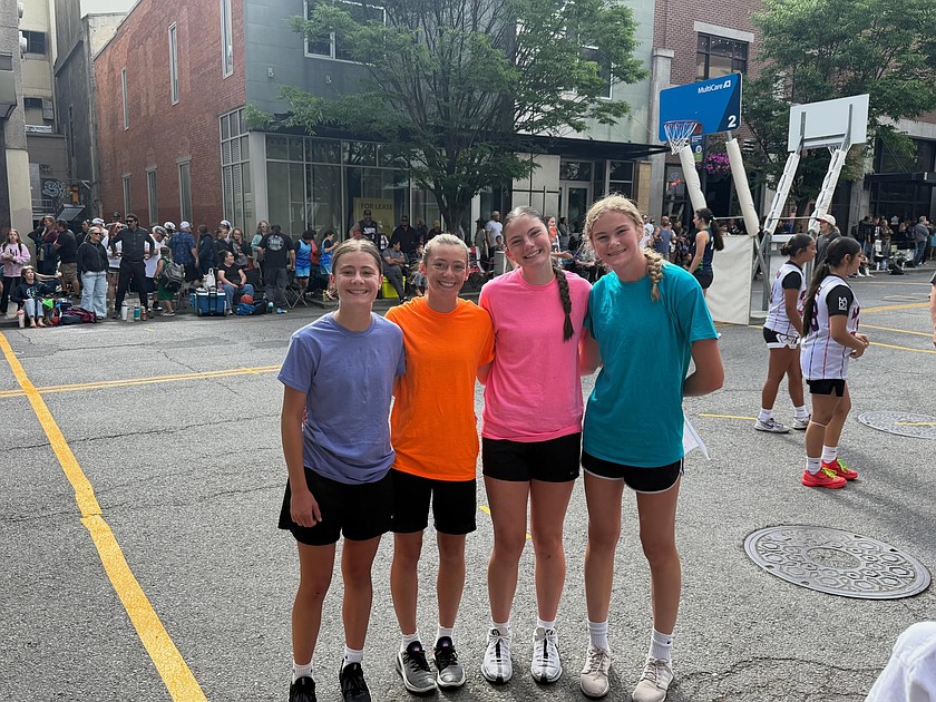 Ephrata’s Da Squad with Sophie Molitor, Ellie Molitor, Maycee Black and Brooklynne Addink stand together on the court ahead of their first game at Spokane’s Hoopfest.