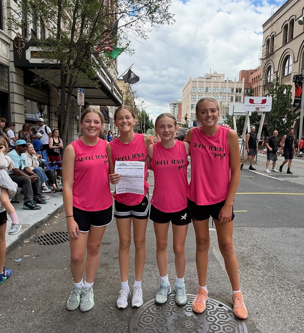 The Small Town Girls team from Ephrata smiles as they take a photo together for Hoopfest.