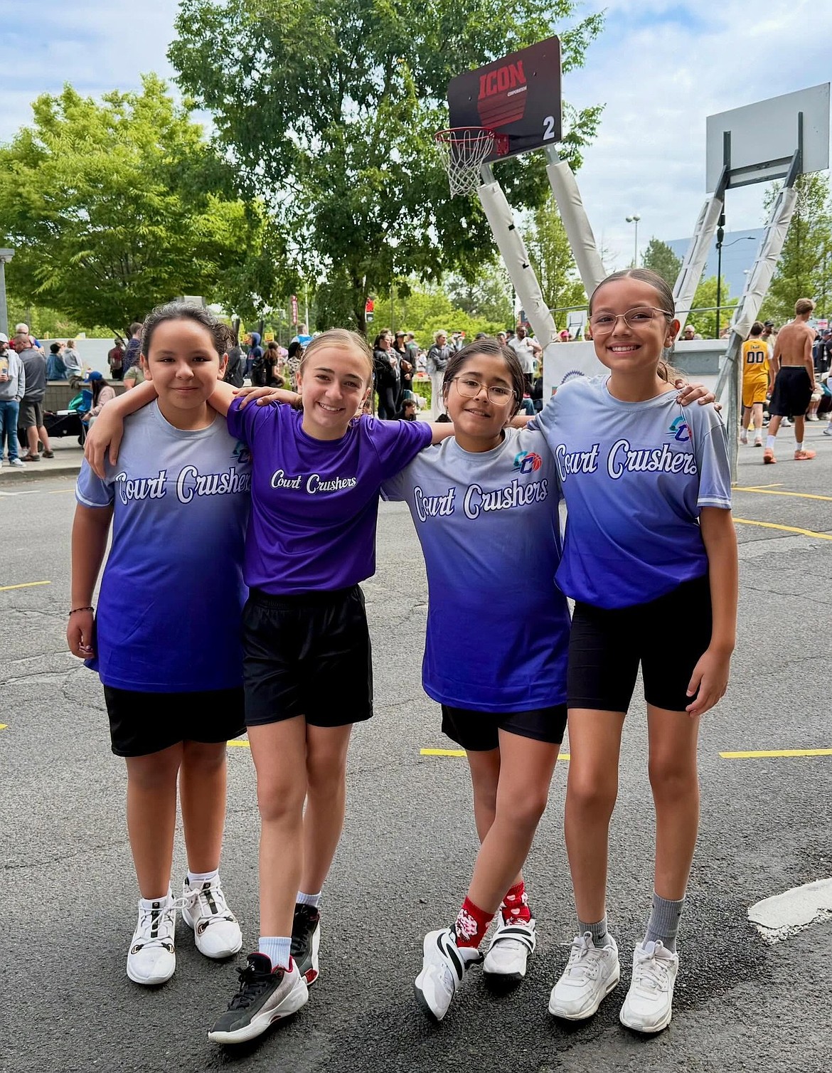 Ephrata’s Court Crushers team takes a group photo on the sideline ahead of one of their games at Hoopfest.