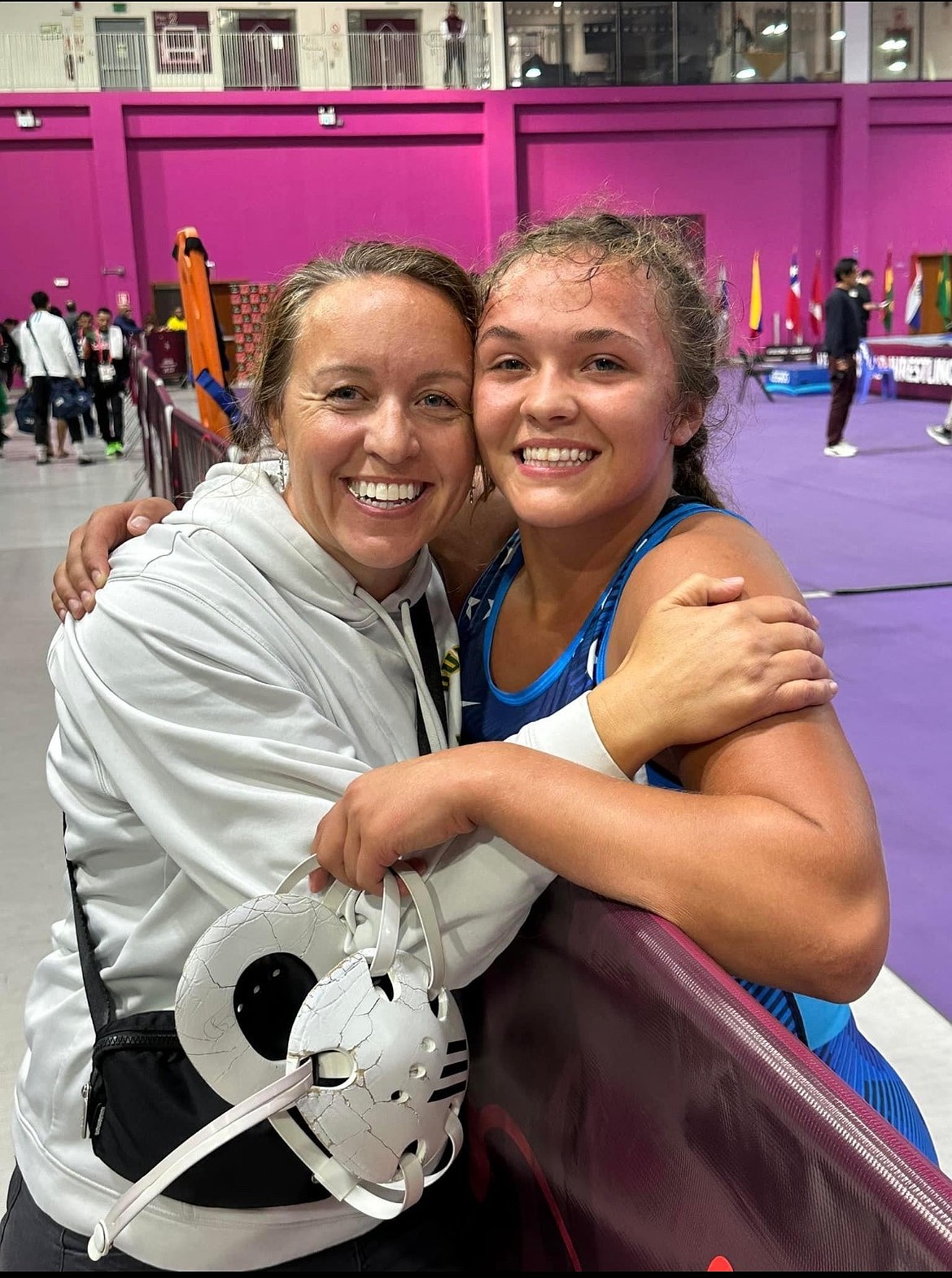 Shannon Workinger (right) hugs her mom Jennifer Gardner (left) while at a wrestling tournament.