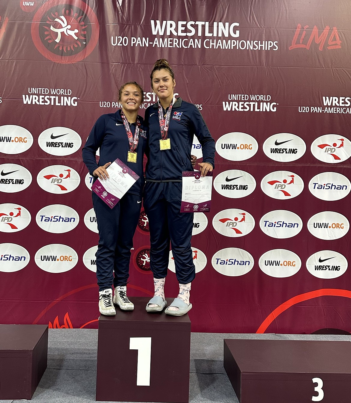 Shannon Workinger (left) stands on the podium with her teammate for the U20 Pan-American Championships.