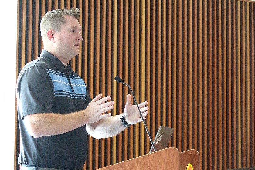 Levi Bisnett, Moses Lake project engineer, goes over data on traffic crashes on roads that were reconfigured last year.