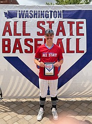 Almira/Coulee-Hartline graduate Caden Correia holds up his All State plaque while competing on Team Baker.