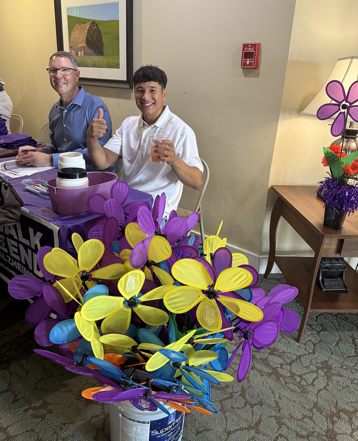 Volunteers at last year’s Purple Party organize teams for the Walk to End Alzheimer’s. The pinwheels will be given out at the Walk, color-coded to identify Alzheimer’s patients, caregivers, loved ones and others.
