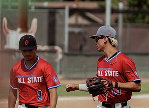 Aiden Garza and Quade Gonzalez walk off the field together during the All-State game in Yakima last weekend.