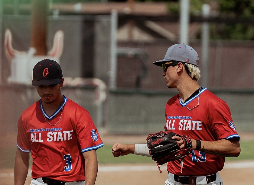 Aiden Garza and Quade Gonzalez walk off the field together during the All-State game in Yakima last weekend.