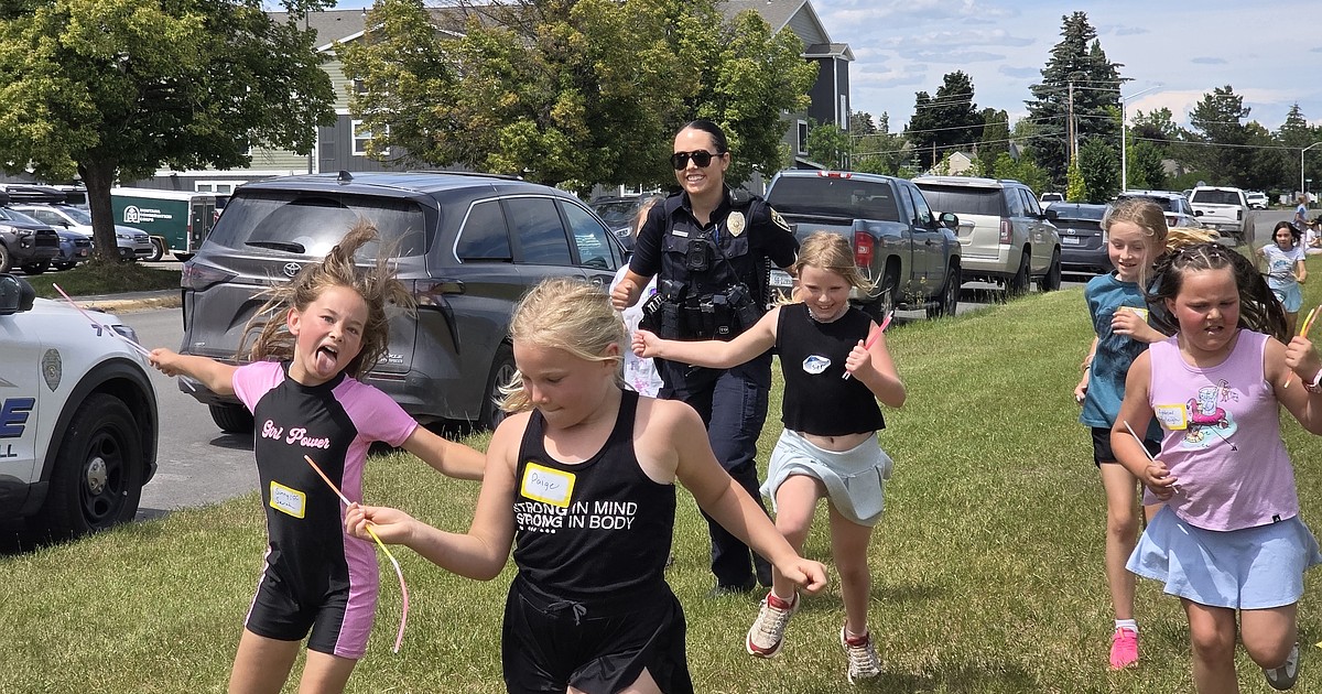 Kalispell officer helps turn a frightening experience for Girls on the Run campers into a positive one