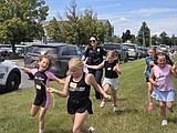 Kalispell officer helps turn a frightening experience for Girls on the Run campers into a positive one
