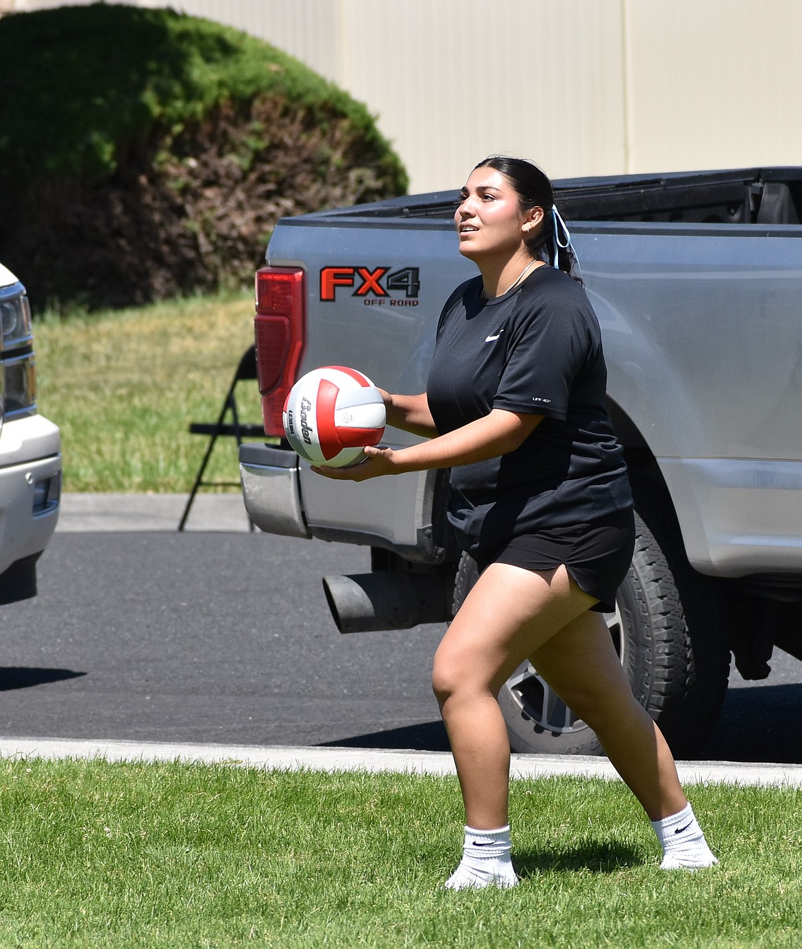 Warden’s Jamylex Pruneda steps up to serve in Othello’s Fourth of July volleyball tourney Saturday afternoon.