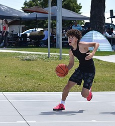 A player from the Ballers finds himself with a clear opening to make a layup at the basket during the Fourth of July 3-on-3 tourney.