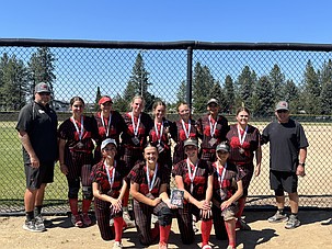 The Washington Rage lines up for a team photo. Front Row, Isabella Suarez, Malorie Lane, Claire Michelbook and Amaiah Martinez. Back Row, Head Coach Bob Richardson, Taylor Peterson, Kylie Christiansen, Rayna Waters, Allie Jensen, Josie Carlstrom, Kylah Young, Brooklyn Bruce and Assistant Coach AJ Lane.