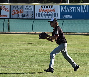 Dayne Holland from the Tigers makes a catch in the outfield and prepares to throw the ball back to the mound in a previous home game this summer.