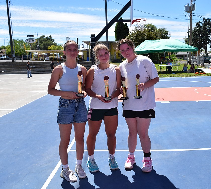 The Chicken Nuggets, consisting of Tanya Zubritskiy, Liana Sushik and Brooke Dana hold up their trophies after winning the girls bracket in the 2026 Soaring Eagles 3v3 Vape Awareness Basketball tournament.