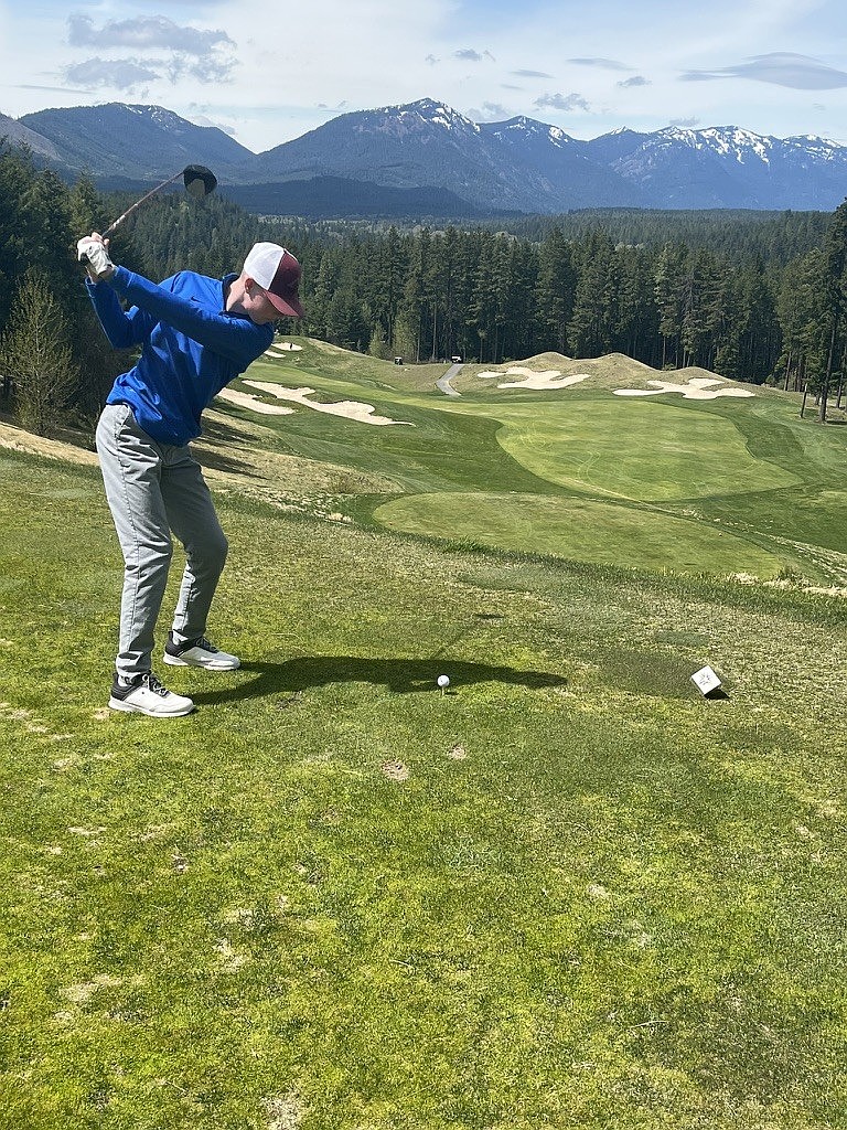 Soren Clausen, golfing for the Warden Cougars, prepares to tee off during the spring season this year.