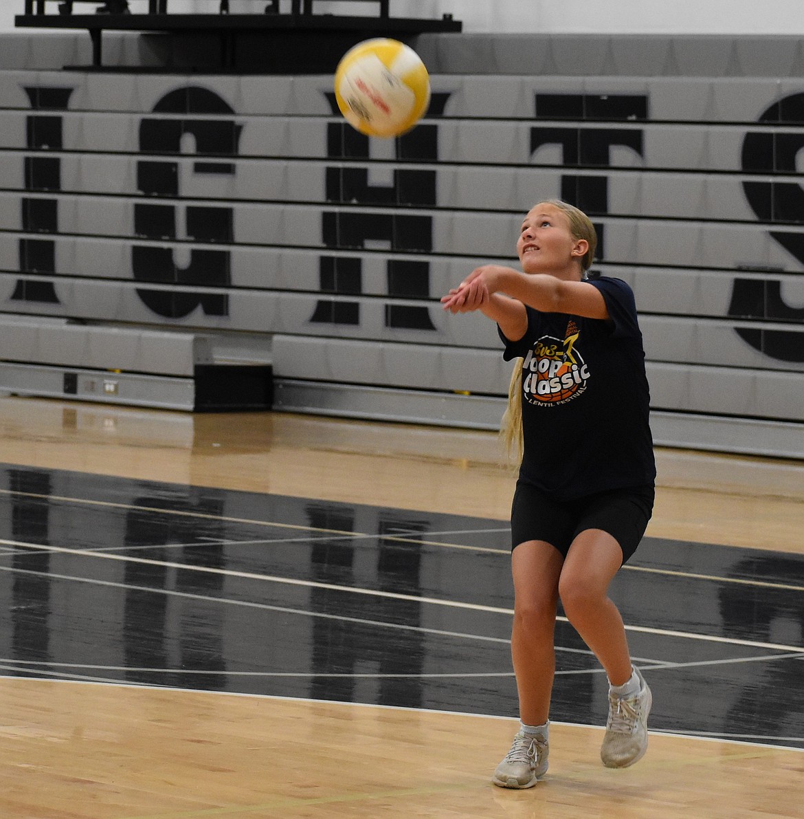 One of the young participants at Friday’s volleyball camp at Royal High School hits the ball back toward her training partner.
