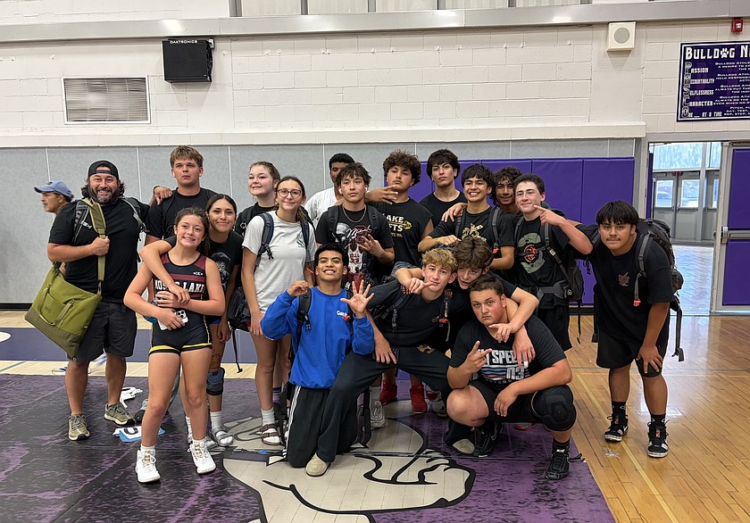 Mavericks wrestlers gather for a group photo ahead of their week of competition in Pasco for the Redneck Duals camp.