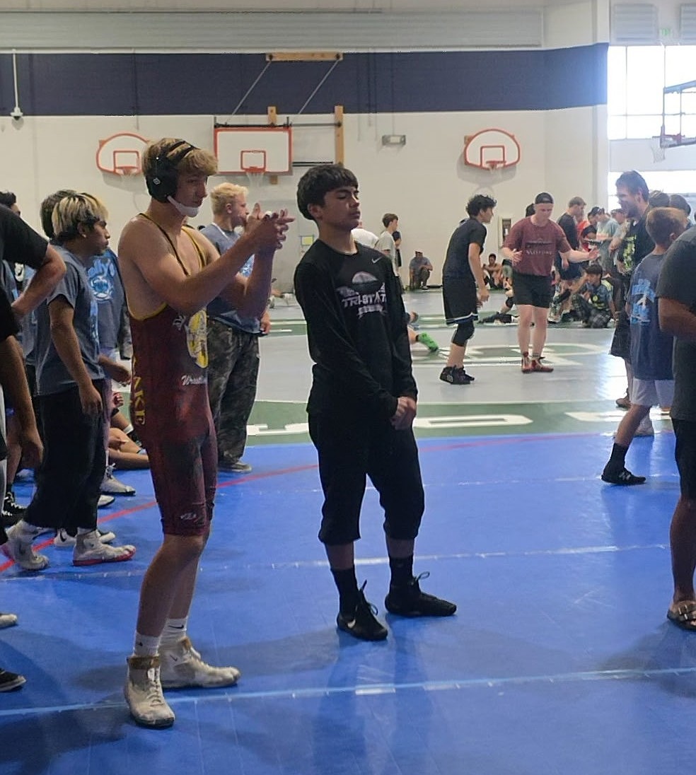Owen Martel, 126 pounds, and Vincent Hunt, 120 pounds, stand together on the mat in Pasco.