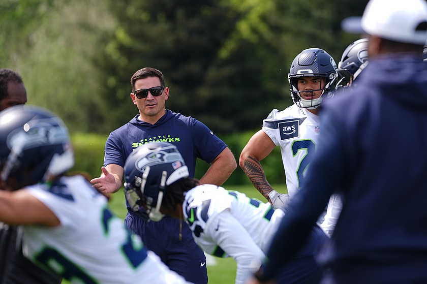 FILE - Seattle Seahawks head coach Mike Macdonald watches defensive player drills during the first day of rookie minicamp at the NFL football team's training facility, May 1, 2026, in Renton, Wash.