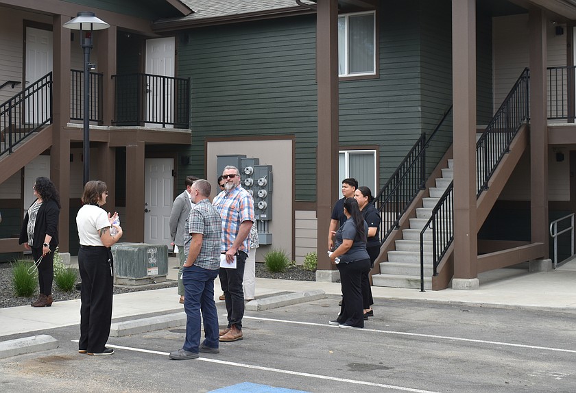 Community members check out the new-and-improved Quincy Manor apartments at a ceremony Tuesday. Quincy Manor is, one of three low-income housing projects in Grant County recently renovated by Catholic Charities Housing Services.