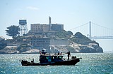 Rescuers keep searching for 3 people after a boat sank in San Francisco Bay, killing 1
