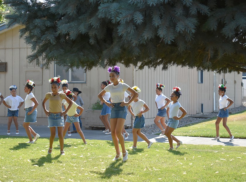 Dancers from Ballet Folklórico Viva México in Warden demonstrate traditional dances on the lawn of the Warden Library Thursday.