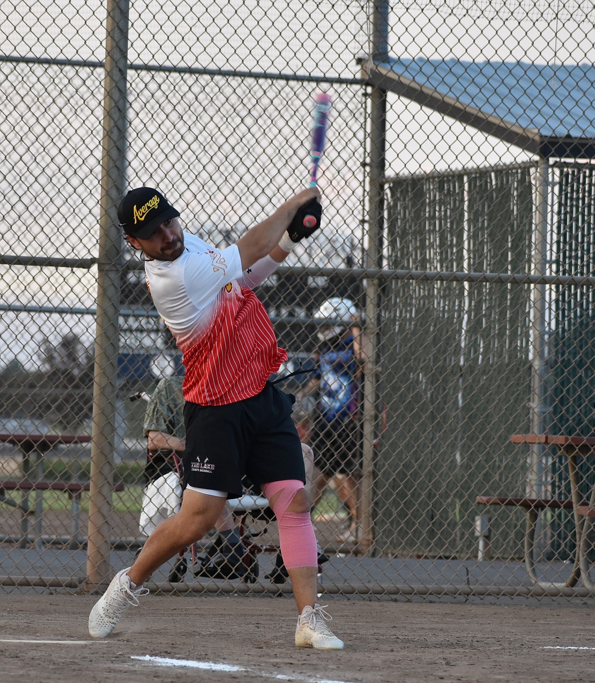 Jaime Vela from the Average Joes takes a swing at a pitch during the championships in the middle division against BFF/Sun Splash Thursday evening.