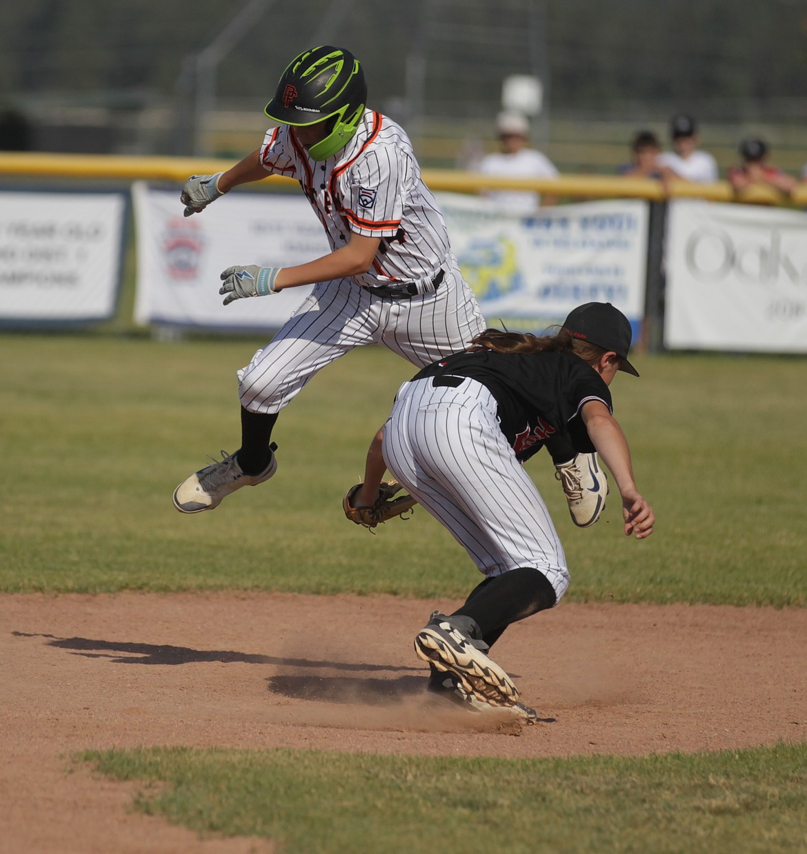 MARK NELKE/Press
Hayden shortstop Curry Felt V (5) tags out a leaping Finn Kinsel (44) of Post Falls at second base during Saturday's Idaho District 1 Little League 12U baseball championship game at Croffoot Park in Hayden.