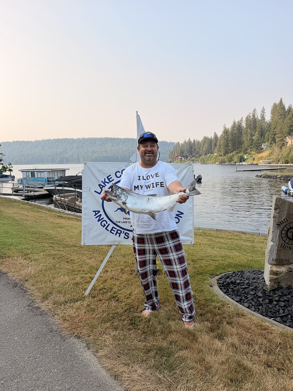 John Shull beams with pride as he holds up his first-place salmon, weighing 11.3 pounds, from the Big One Derby on Wednesday.