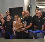 Podium cuts ribbon on new, expanded physical therapy and training clinic