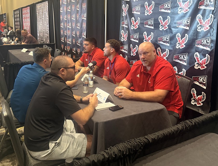 Eastern Washington Football Head Coach Aaron Best (right in red), Malik Dotson (middle in red) and Isaiah Perez (left in red) answer questions for media day at the Big Sky Kickoff Weekend in Spokane.