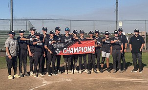The Central Washington Sixers 14U gathers at home plate to celebrate winning the Moses Lake Meltdown tournament.