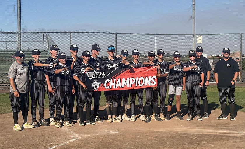 The Central Washington Sixers 14U gathers at home plate to celebrate winning the Moses Lake Meltdown tournament.