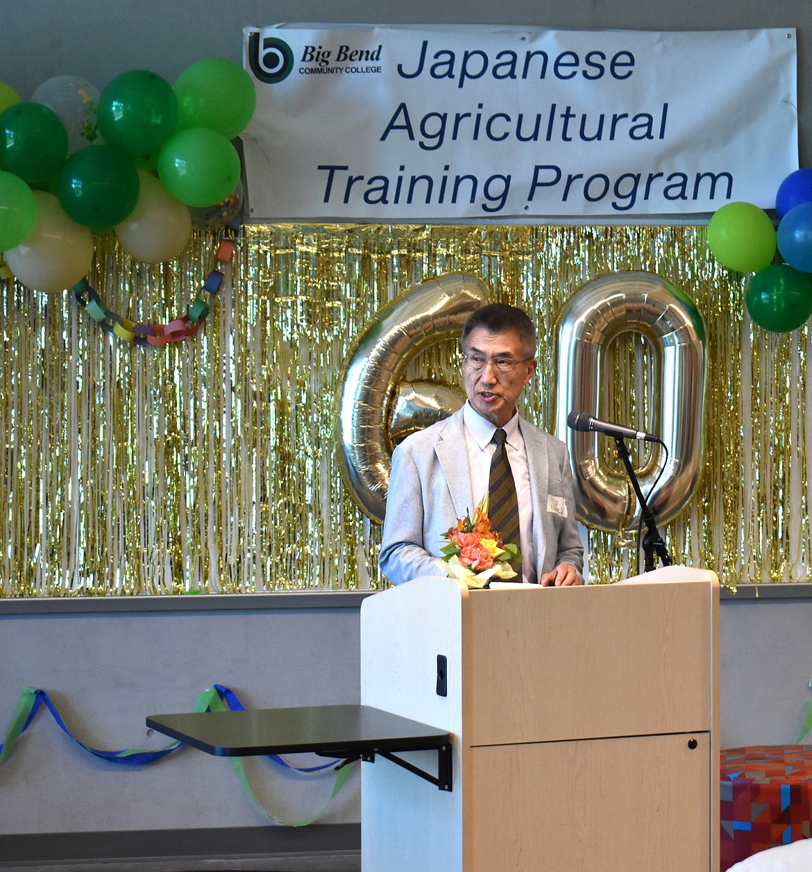Takashi Yoshikawa, executive director of the Japanese Agricultural Exchange Council in Tokyo, speaks Monday about the desperate need for farmers and improved agriculture in Japan.