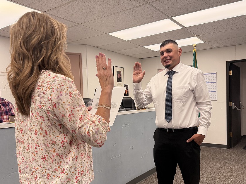 At the July 28 Warden City Council meeting current City Administrator Kriss Shuler swears in Assistant City Administrator Joseph Elizalde. Elizalde will work alongside Shuler for the next three months to learn the role before she retires Oct. 31 and he takes over the city administrator position.