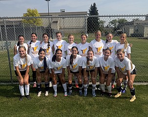 The Mavs’ girls soccer players huddle up for a group photo at the Eastern Washington University soccer camp. The Mavs attended the three day camp where they got to learn from college coaches and players while also bonding as a team.
