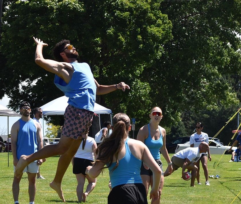 A player from Team Powerade leaps up to spike the ball at his opponents during the Othello Fourth of July volleyball tournament. Team Powerade went on to take first-place in the competition.