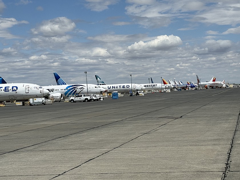 Boeing commercial passenger and cargo jets lineup outside the company's facility at the Port of Moses Lake. The aircrafts get prepared for final delivery to their new owners.