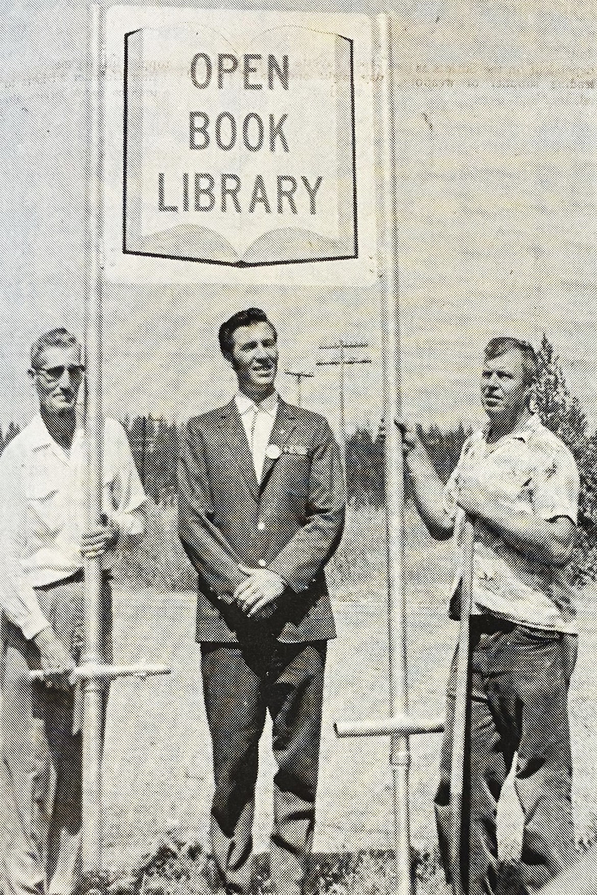 In 1971, project manager James McMurray, left, Robert McMurray and Charles Poland posed with the highway sign for the new Athol library.