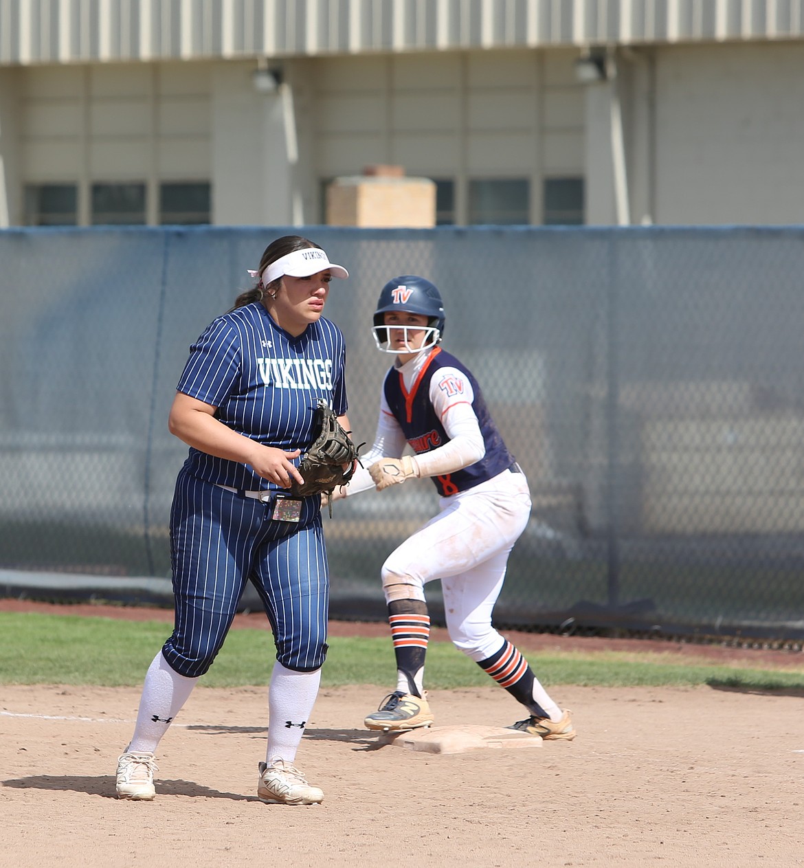 During the 2026 softball season, Jaeda Gonzalez stands ready at first base to get an out against her opponent.