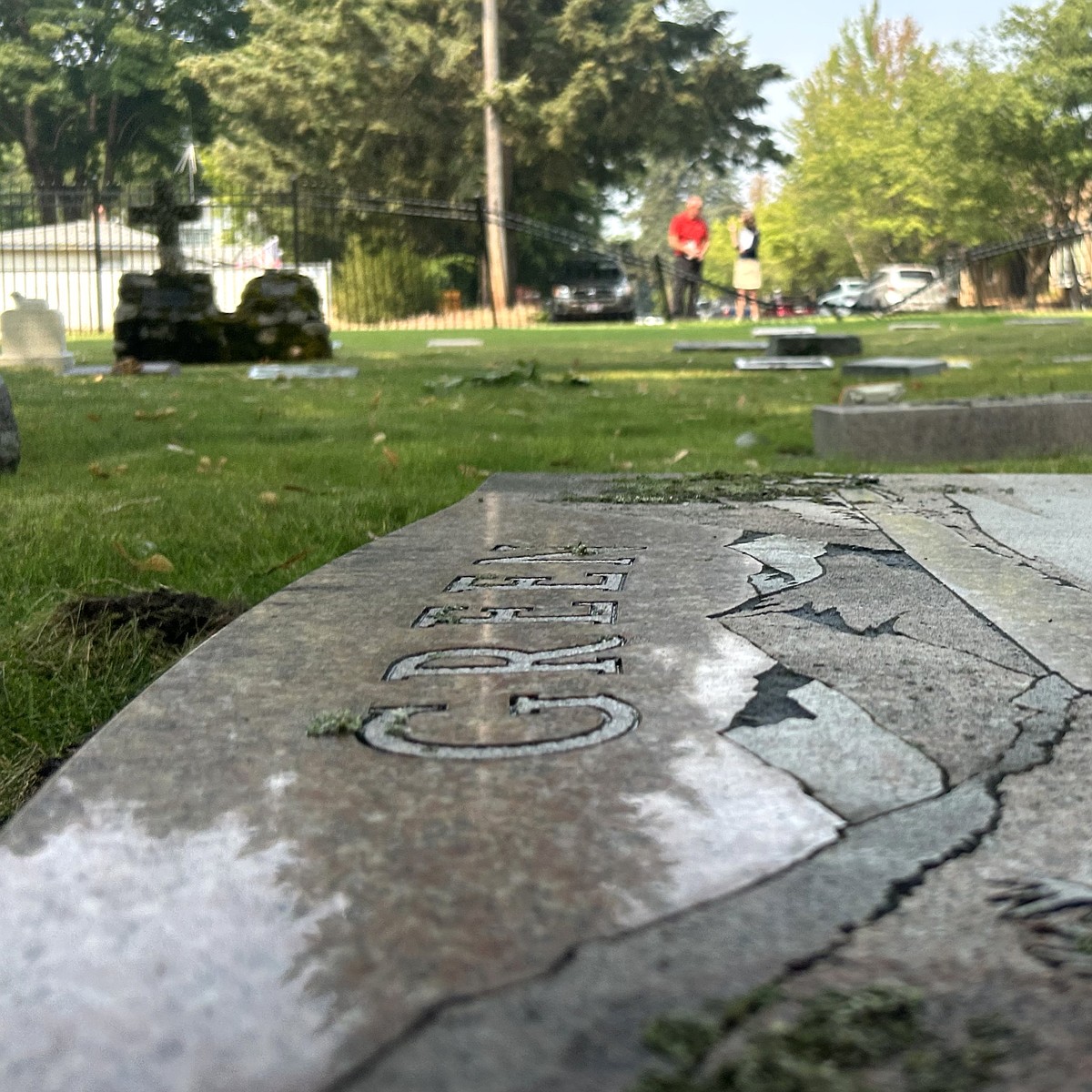 Driver crashes through St. Thomas Cemetery fence, headstones