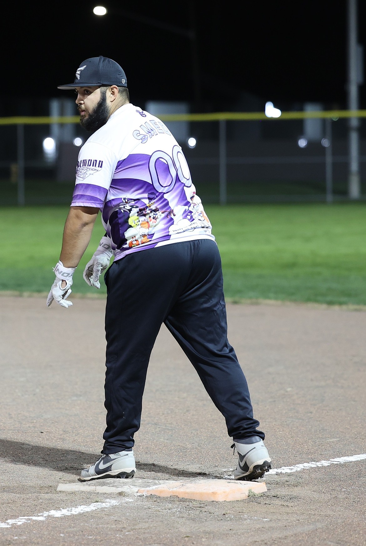 A player representing Raymond Construction prepares to run toward second base during a game in Othello. Othello and Moses Lake’s adult softball leagues work in conjunction with one another to help build both communities.