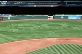 Desert Green Turf in Moses Lake installs logo for Mariners 50th Anniversary